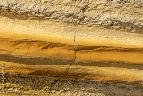 Detail of the texture of the Etretat cliffs in the Normandie region of France in a sunny day. Falaise d'amont chalk clliffs in the Alabaster coast.