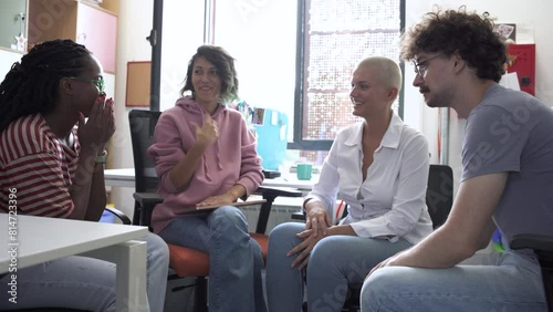In a dynamic college office, a group of students brainstorming about education, culture, human rights, and race equality.	