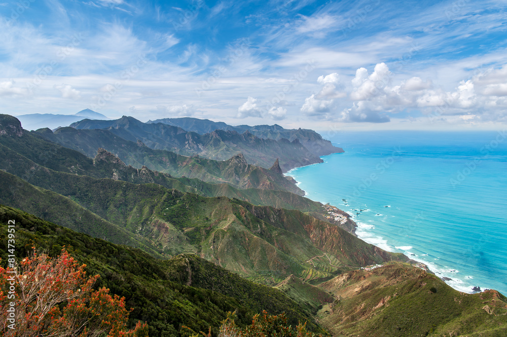 View from Cabezo del Tejo in Tenerife, with panoramic mountain views, lush vegetation, and turquoise coastal waters. Perfect for nature lovers and photographers.