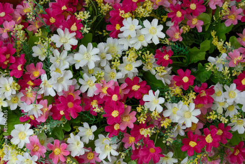 A beautiful bouquet flower consists of flowers of various colors. Orange, red, yellow, white and daisies