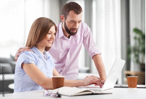 Happy man and woman relax with computer at home
