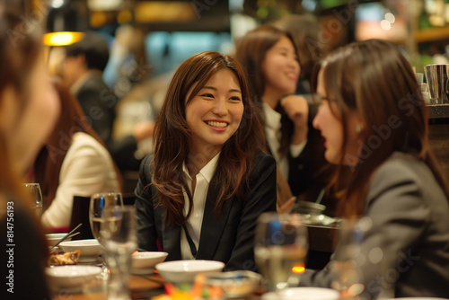 After a long day at the office  beautiful Korean businesswomen group gather at an izakaya to unwind. Clad in Private attire   they share stories  laughter  and sake 