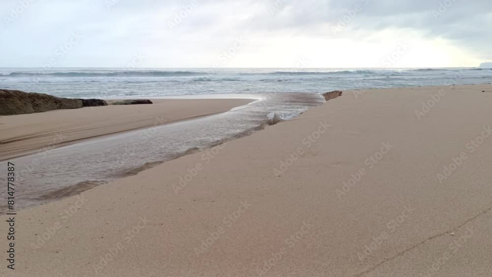 Landscape view of sea sand, moss and coral rocks on a cloudy summer day. Molang Beach, Tulungagung, Indonesia Landscape view of sea sand, moss and coral rocks on a cloudy summer day. Molang Beach, Tulungagung, Indonesia