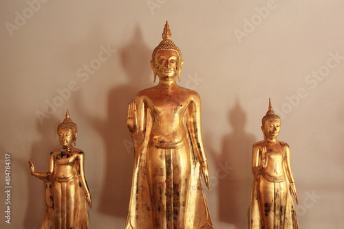 Golden Buddha statues lined up. Phra Rabiang is one of the elements built around the Wat Pho temple in Bangkok, Thailand 
