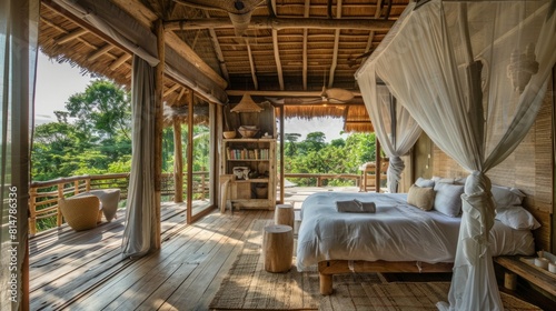 A bedroom with a bed, and a balcony overlooking the jungle full of lush greenery and wildlife. © Emiliia