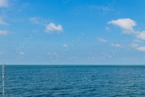 Wallpaper Mural Blue sky with white clouds and the ocean deep indigo in daylight. Torontodigital.ca