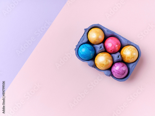 Flat lay with colored easter eggs on bright background photo