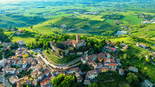 Ancient castle in the town of Cigognola, a view of town from a height. Drone photo photo