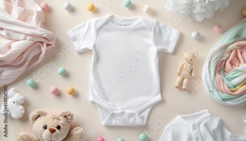 white baby bodysuit shirt with children toys on beige background, flat lay, top view, copy space,mock up, mockup
