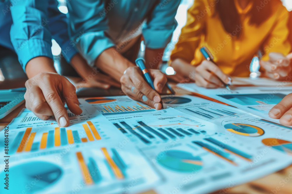 Hands business team having a meeting to analyze data graph charts for a marketing plan. Hands business team having a meeting to analyze data graph charts for a marketing plan.