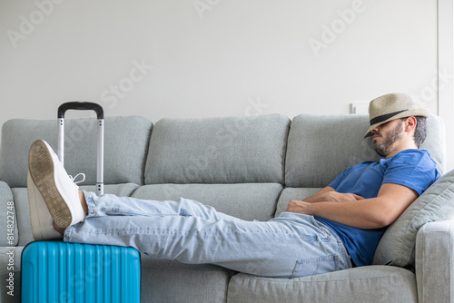 man with his hat on waiting for it to be time to go on vacation