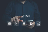 ISO standards quality control, assurance and warranty business technology concept. Touching on screen with ISO and globe icons on smart background. ISO Standard certification. Modern ISO banner.