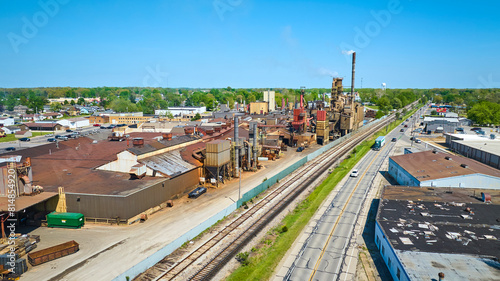 Obraz na plátne Aerial View of Industrial Plant, Railroad, and Road in Warsaw, Indiana