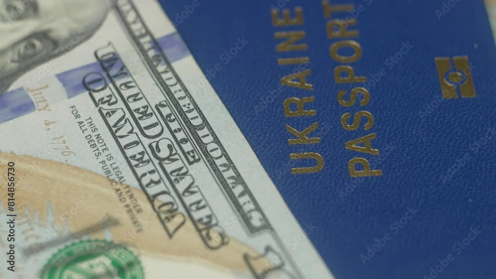 Ukrainian passport and american dollar. Business, inflation and deflation concept. Finance money background. Assistance to Ukrainian refugees. Cash payment to people in need Ukrainian passport and american dollar. Business, inflation and deflation concept. Finance money background. Assistance to Ukrainian refugees. Cash payment to people in need