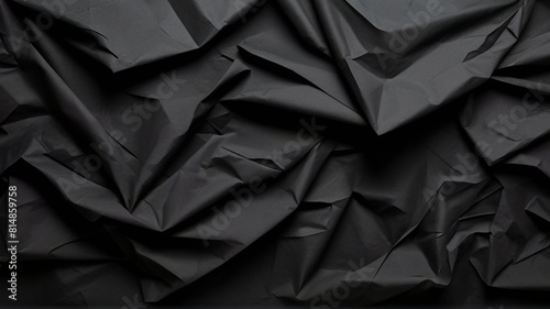 Crumpled Black paper texture background overlay effect © sakda
