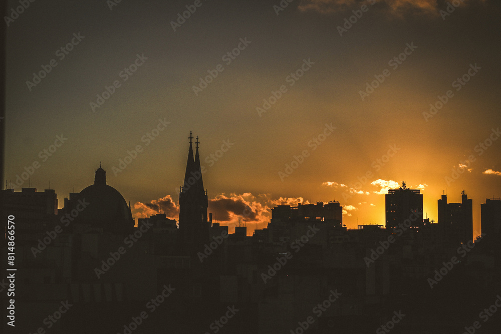 Naklejka premium City skyline at sunset, são paulo city with buildings and church 