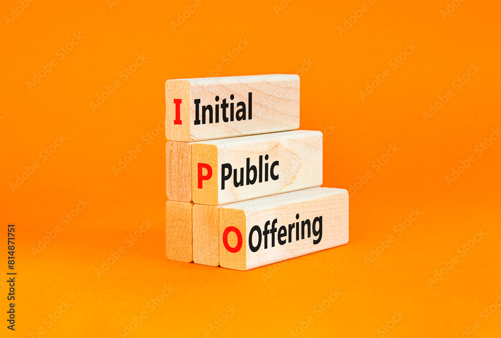 Naklejka premium IPO initial public offering symbol. Concept words IPO initial public offering on beautiful wooden blocks. Beautiful orange background. Business IPO initial public offering concept. Copy space.