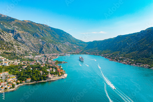 Spectacular View of Kotor Bay: Mountains, Cruise Ship, and Azure Waters