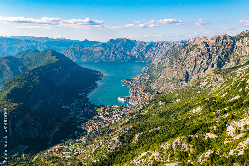 Spectacular View of Kotor Bay: Mountains, Cruise Ship, and Azure Waters Spectacular View of Kotor Bay: Mountains, Cruise Ship, and Azure Waters