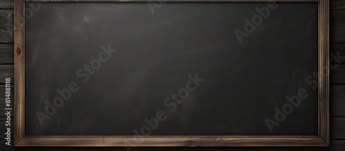 A blackboard with a frame is used for advertising purposes providing a blank space on which to display messages or information. Copyspace image