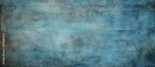 A vintage old paper wallpaper with strange dirty patterns creates a unique aesthetic The blue color adds depth and it has a horizontal orientation The design offers ample copy space image