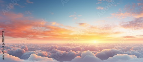 A stunning summer sky with warm tonalities and a sunny dawn above fluffy clouds The captivating landscape provides a natural backdrop The image is an ultra wide panorama in a banner format allowing a