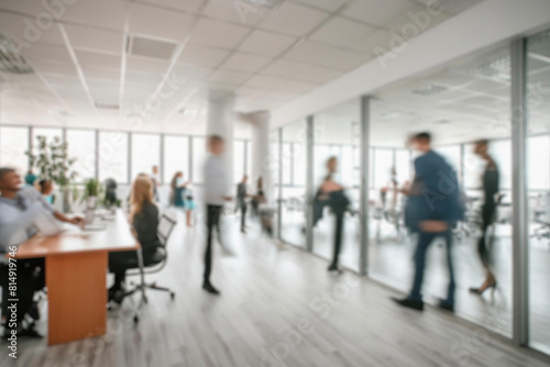business people walking in the corridor of an business center, pronounced motion blur, crowded bright modern light office movement defocused. office background busy. talking and rushing in the lobby.