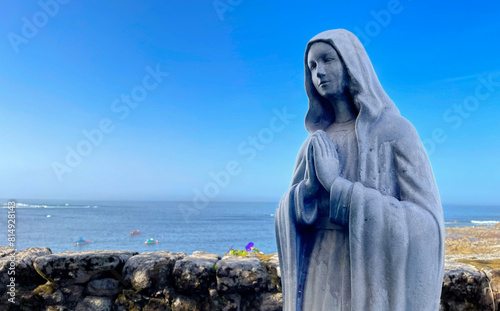 A statue of the virgin in the courtyard of a monastery on the Galician coast