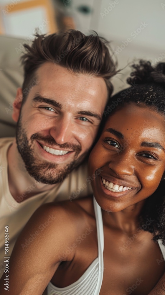A joyful couple sharing a warm embrace their smiles radiating happiness against a blurred background. A joyful couple sharing a warm embrace their smiles radiating happiness against a blurred background.