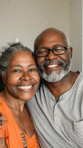A joyful couple embracing smiling with warmth and affection their happiness radiating in a close-up portrait.