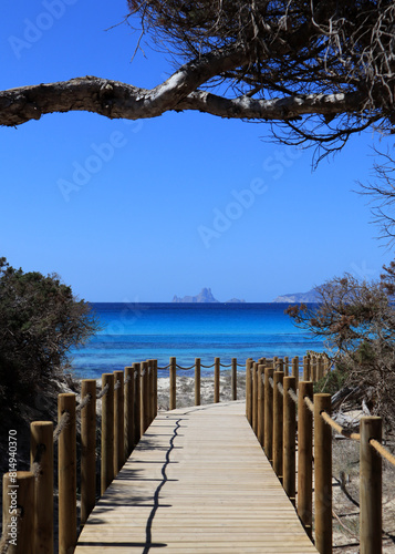 Footbridge on a sandy beach in Formentera with a wiew on Es Vedrà – Ibiza