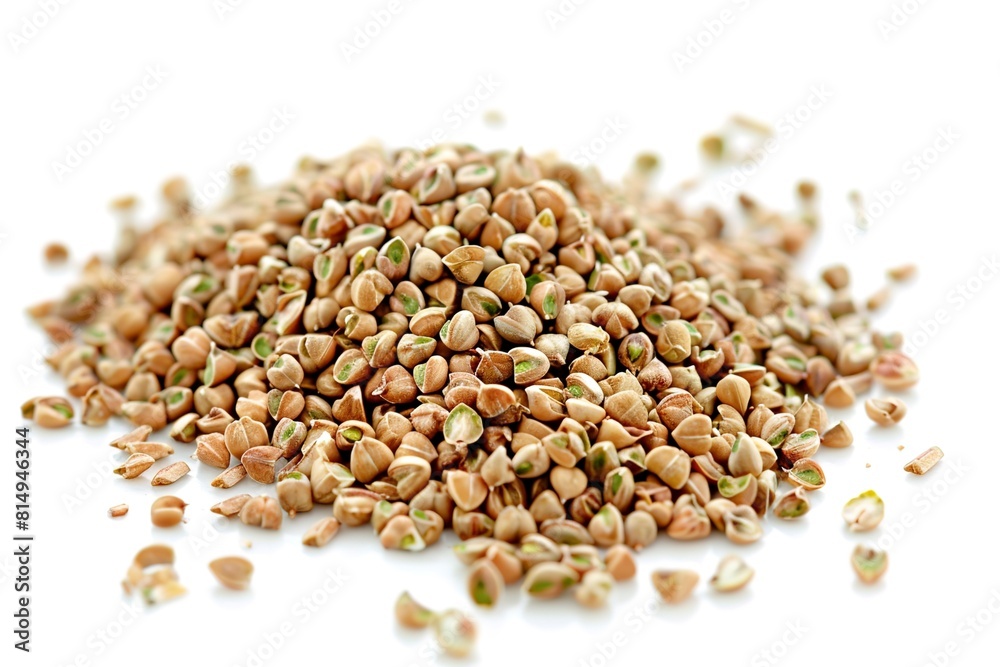 Organic green buckwheat grains isolated on white table Organic green buckwheat grains isolated on white table