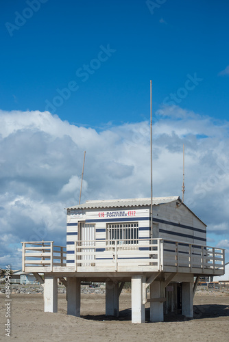 Gruissan - France - 27 April 2024 - view of wooden life guard station on the beach on beautiful cloudy sky background