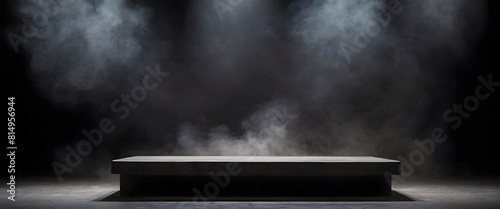 The stone display stands were billowing smoke against a black background.