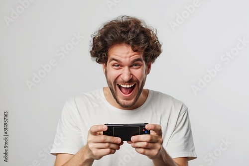 Portrait of unshaven excited man playing online game © Jorge Ferreiro