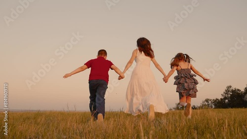 mother runs into sunset holding her son daughter hand, happy family running, boy girl, dream we can be whoever we want, inspiring run reflects essence happy carefree childhood, building memories, our photo