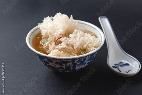 Marinated Tremella mushrooms salad. White coral fungus or snow fungus with  green onion, soy sauce. Asia, Korea, China, Russia mushrooms, dark 