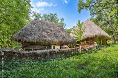 Gorgeous summer scene of traditional romanian peasant houses.