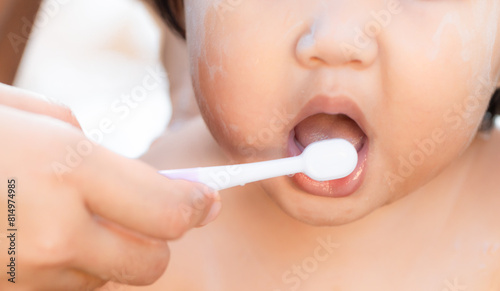 Girl practicing brushing her teeth,A child aged of one year old. Healthy and kid concept.