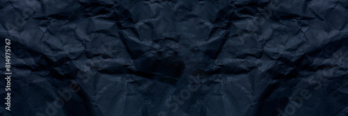 Black paper texture Black crumpled paper texture in low light background