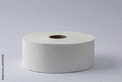 Toilet paper roll on grey white background.