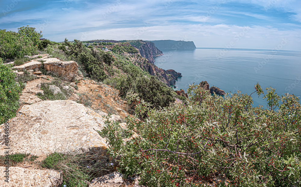 Seascape . Panoramic view of the sea coast of the Black Sea in the area of Cape Fiolent. Hiking trail at Cape Fiolent. Hiking trails on Cape Fiolent Seascape . Panoramic view of the sea coast of the Black Sea in the area of Cape Fiolent. Hiking trail at Cape Fiolent. Hiking trails on Cape Fiolent