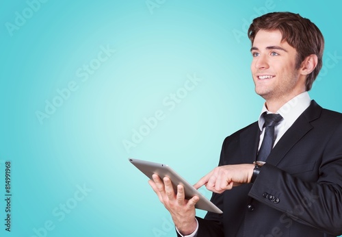 Portrait of positive man holding digital tablet