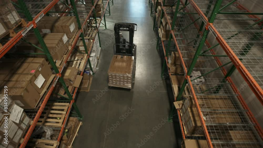 High angle view of approaching forklift driver in warehouse / American Fork, Utah, United States