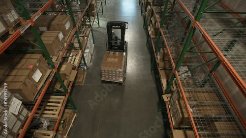 High angle view of approaching forklift driver in warehouse / American Fork, Utah, United States