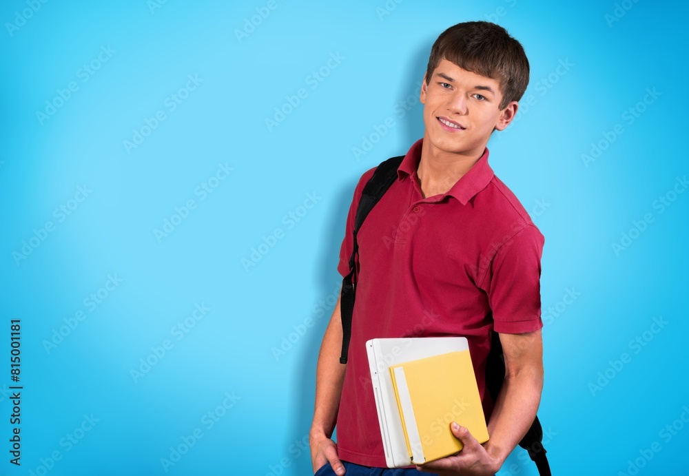 Obraz premium Young college student posing on background
