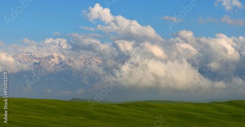 Picturesque clouds over a high mountain plateau on a spring evening