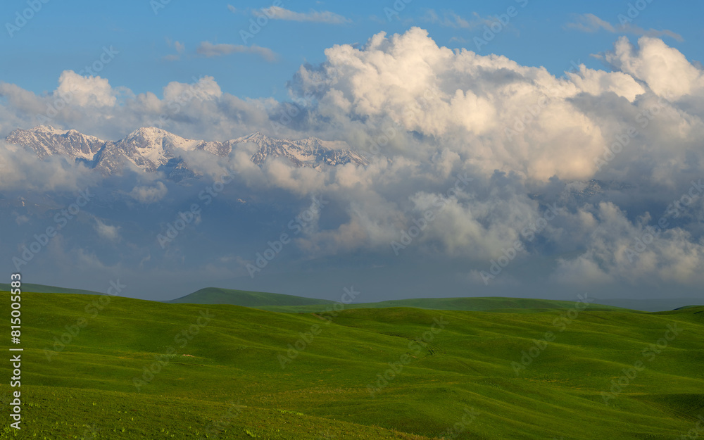 Picturesque clouds over a high mountain plateau on a spring evening Picturesque clouds over a high mountain plateau on a spring evening