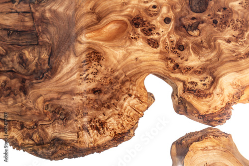 Live edge elm burl slab table top with central epoxy resin river on white background, combining natural wood with a synthetic material close view photo