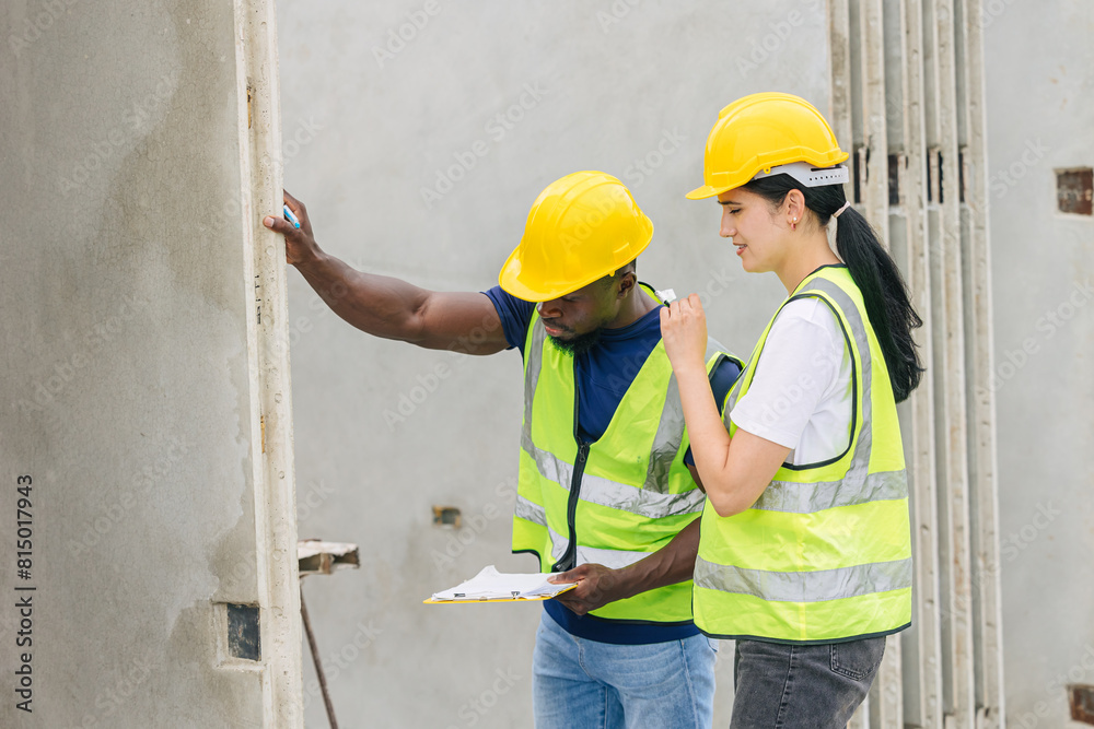 Engineer smart women working contact with African black worker in Precast concrete casting manufacturing company site inspector Engineer smart women working contact with African black worker in Precast concrete casting manufacturing company site inspector
